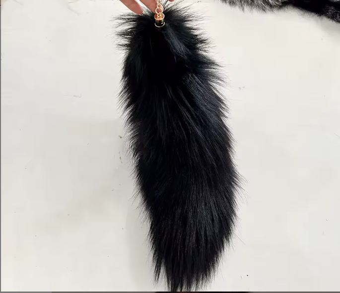 Black fur keychain on a white background