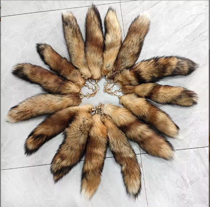 Brown fox tails arranged in a circle on a tile floor