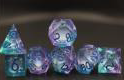 Blue and purple dice with a silver glitter liquid core. Pictured are a D4, D6, D8, D10, D12. D20 and Percentile die. 