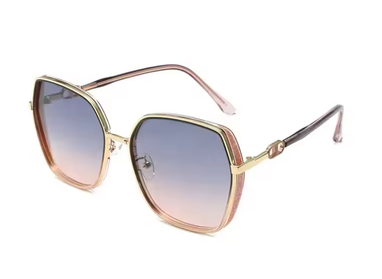 Sunglasses with gold frame and blue gradient lenses on a white background