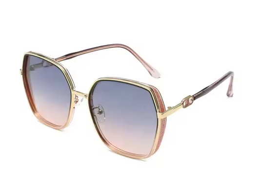 Sunglasses with gold frame and blue gradient lenses on a white background