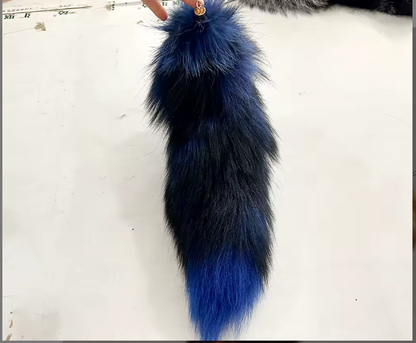 Blue and black fur tail on a white background