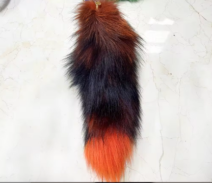 Fur tail with black and orange colors on a white background