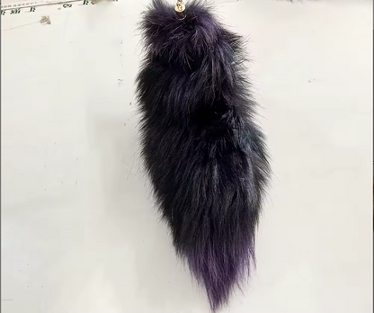 Black fur keychain on a white background